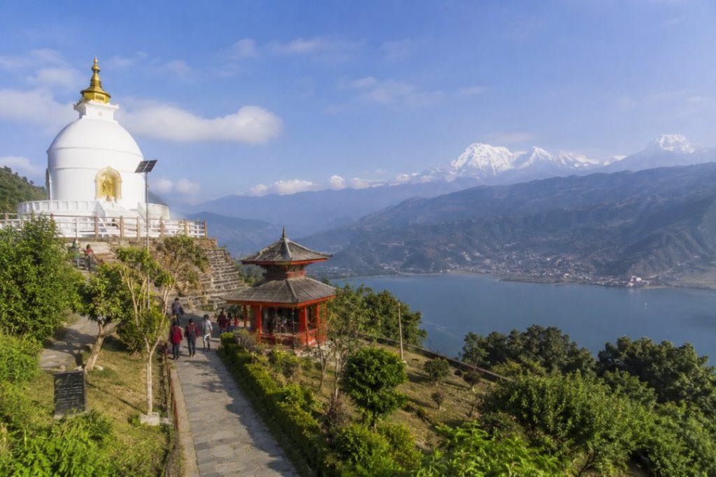 World Peace Pagoda in Pokhara overlooking Phewa Lake with mountain views, cultural sites, and natural landscapes near Lakeside.
