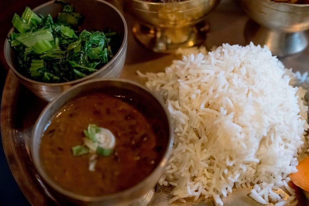 Delicious image of rice meat and spinach combo ready to serve our guest who comes in hotel Janani for food in low price to spend our pokhara trip cost in other things 