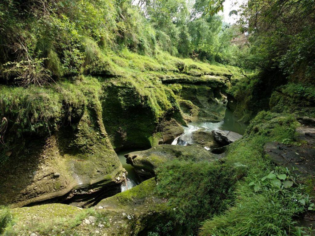 Water flowing into the underground tunnel at Davis Falls in Pokhara