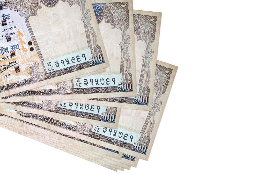 Close-up of Nepalese 500 rupee notes on a white background