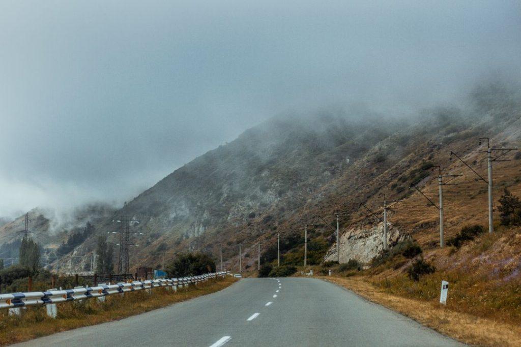 Mountain road on the Kathmandu to Pokhara highway during foggy weather